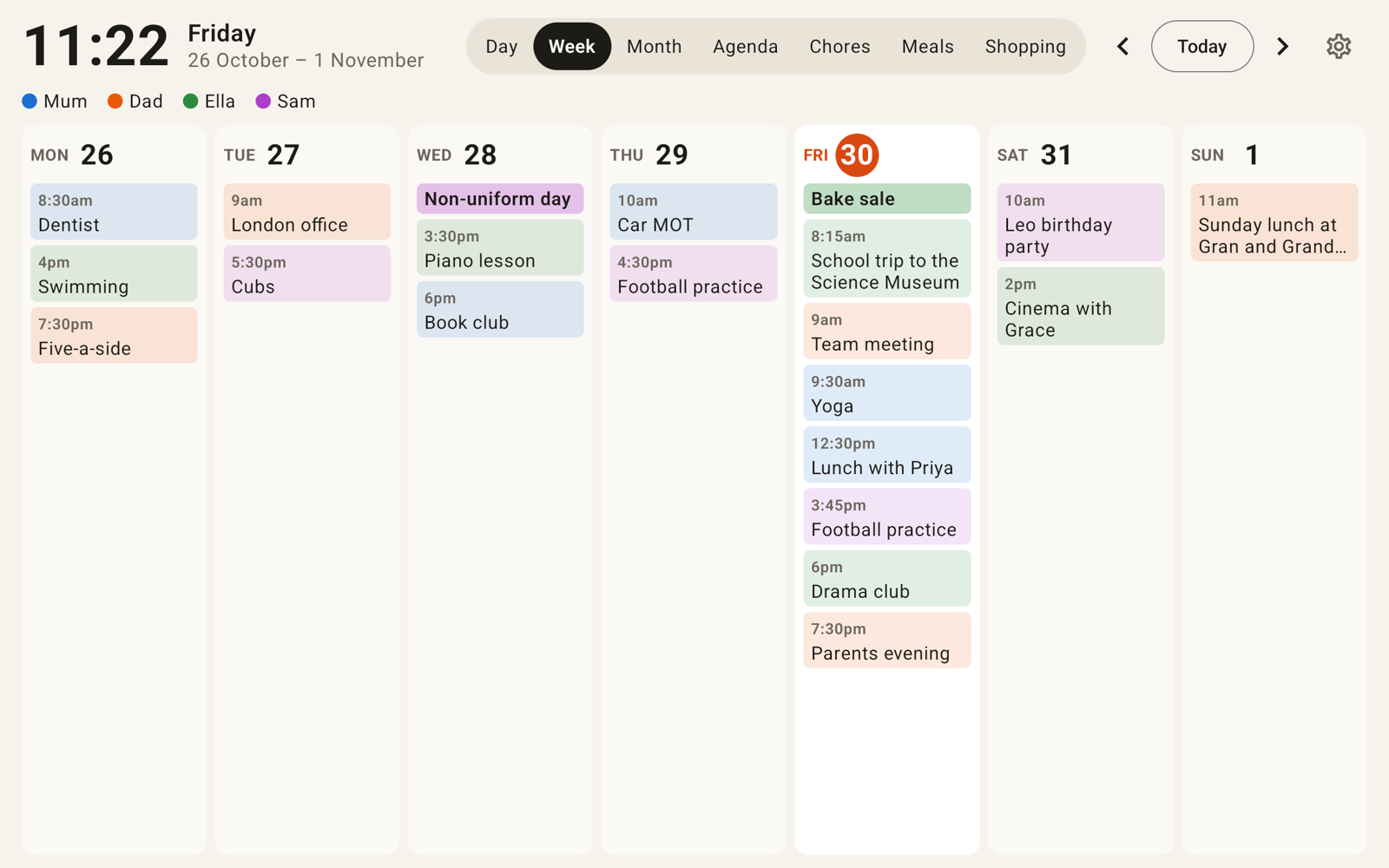 Daywall's week view on a landscape tablet: seven columns of colour-coded family events under a large clock